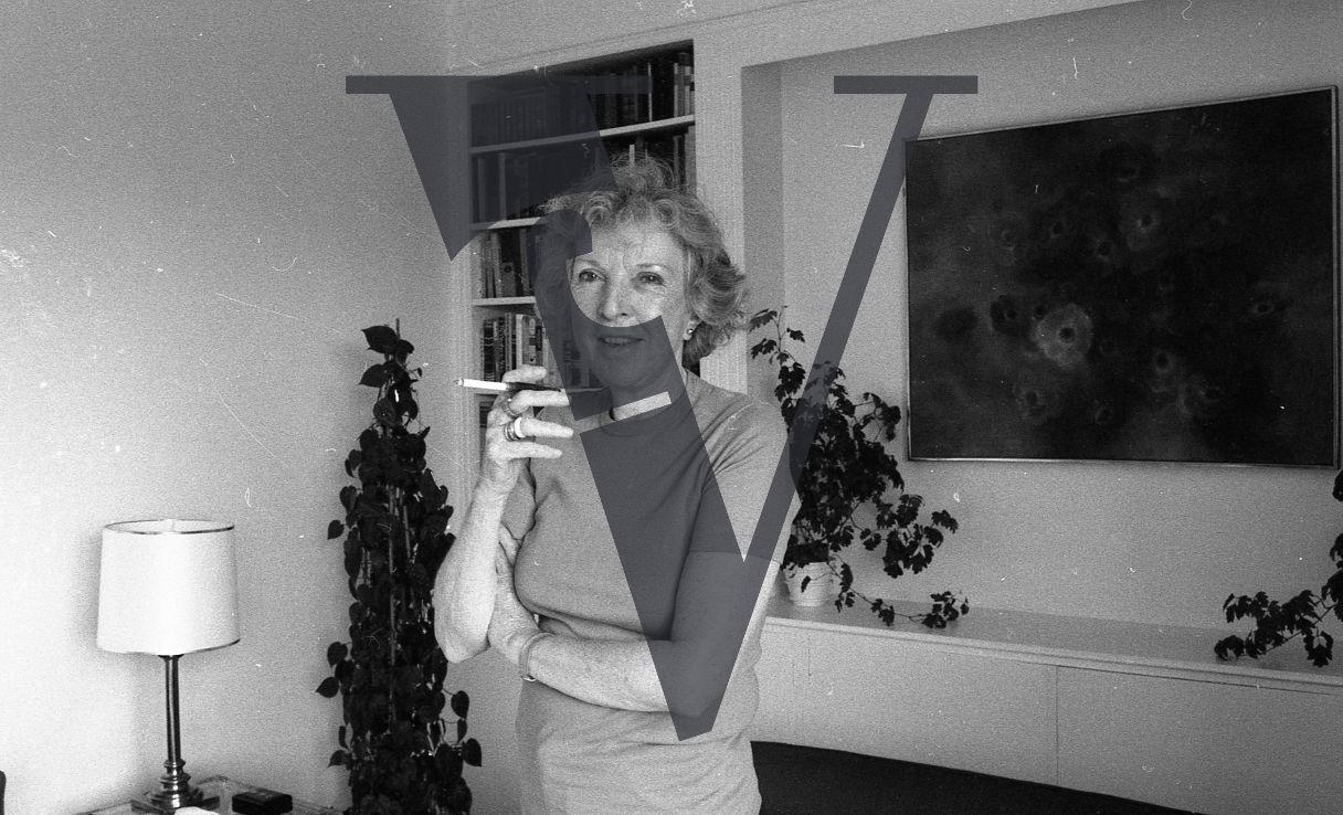 Martha Gellhorn, portrait, smoking cigarette, wide.