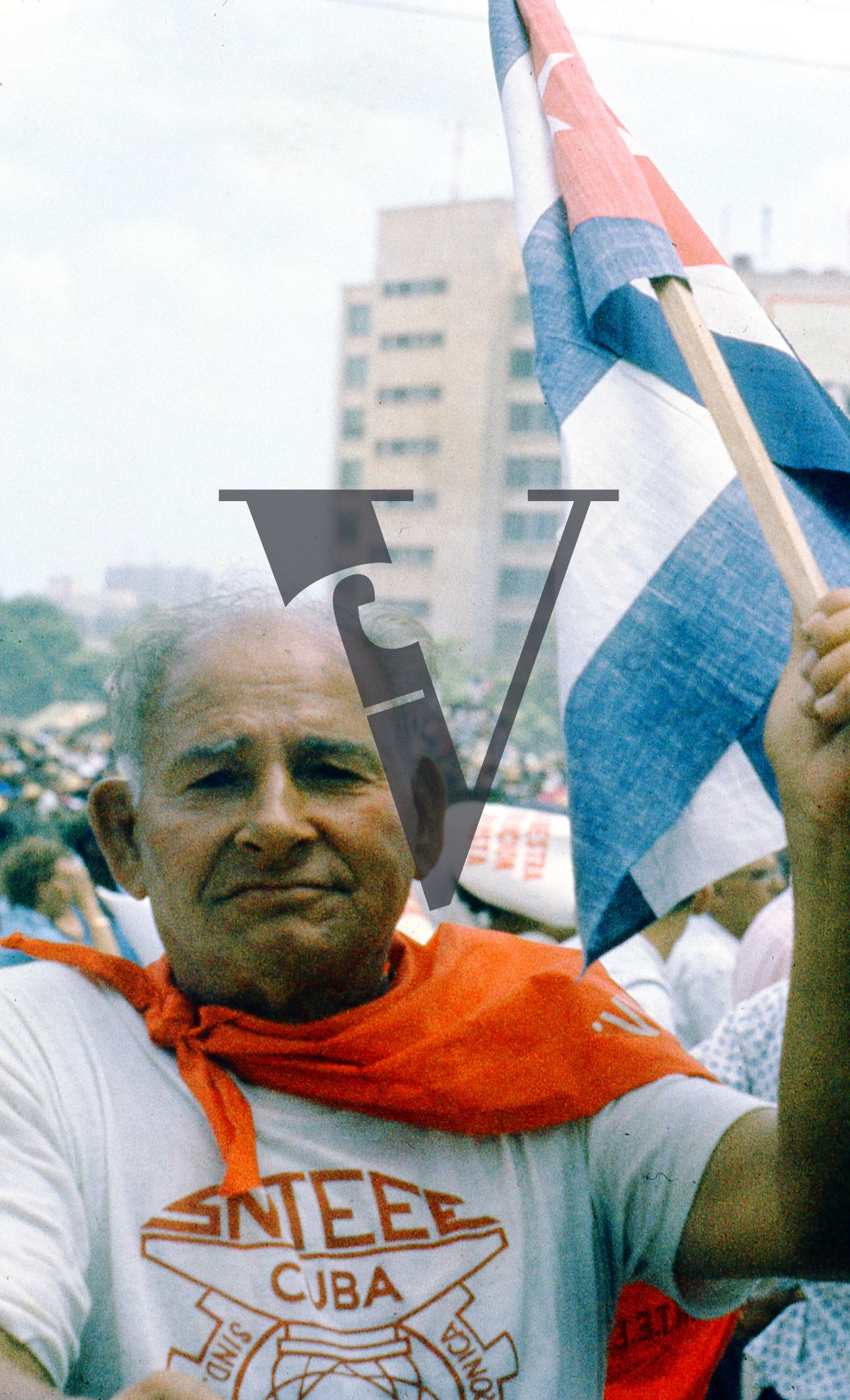 Cuba, Havana, May 1st Parade, elderly man with flag.