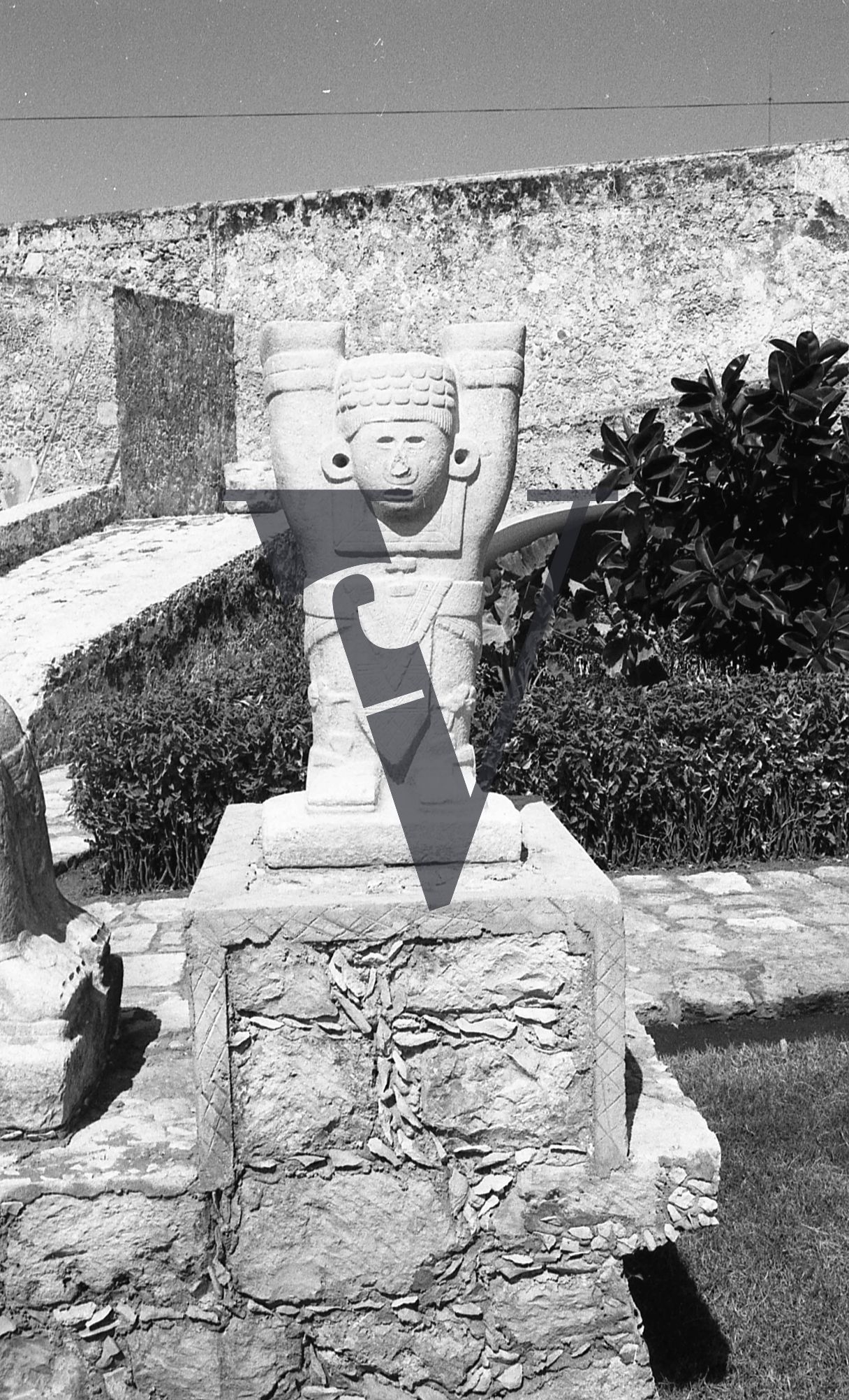 Mexico, Aztec sculpture, hands aloft.