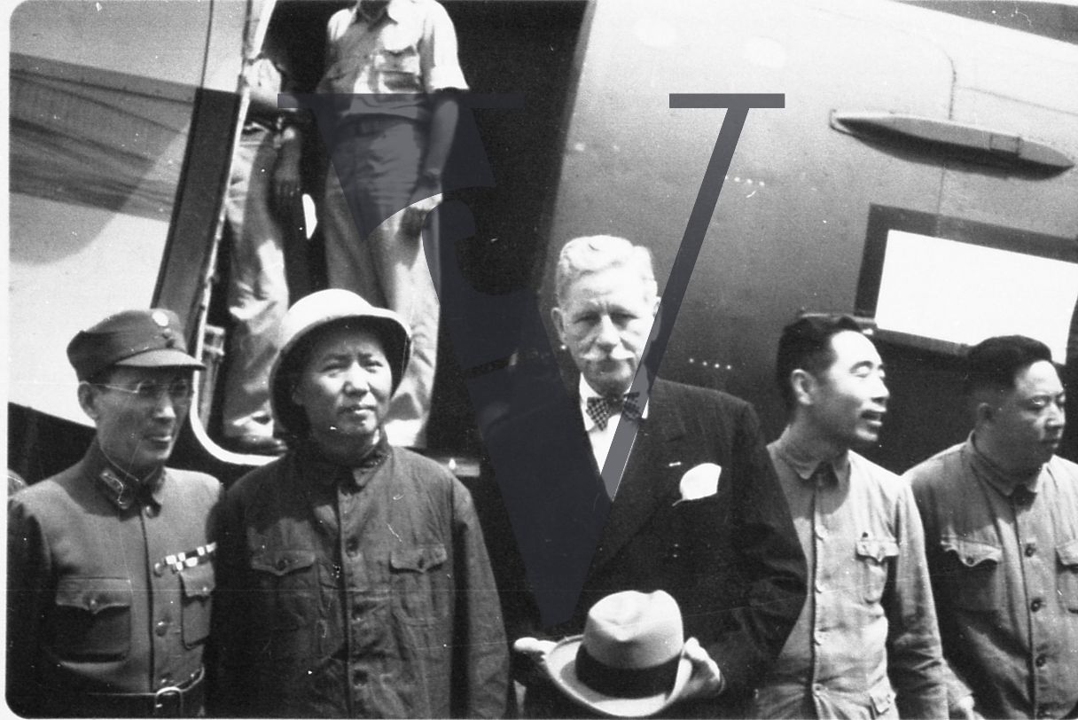 China, Yenan, Mao Zedong, General Patrick J. Hurley, Zhou Enlai, Chinese officials, US servicemen, plane.
