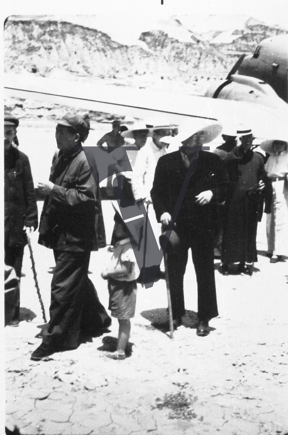 China Yenan, Mao Zedong with daughter, Chinese officials, entourage, plane, landscape, full shot.