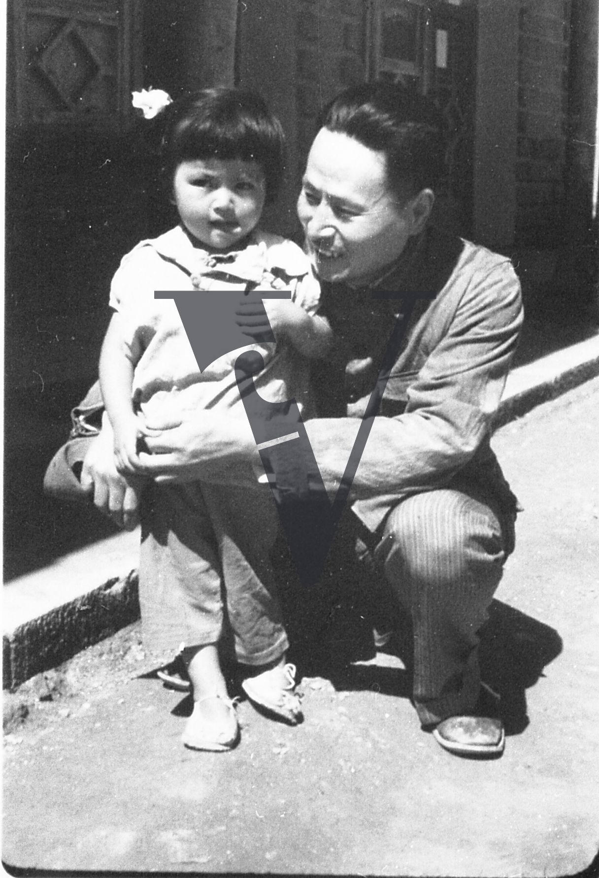 China Yenan, Xu Xiaobing with daughter, photogapher, portrait, full shot.