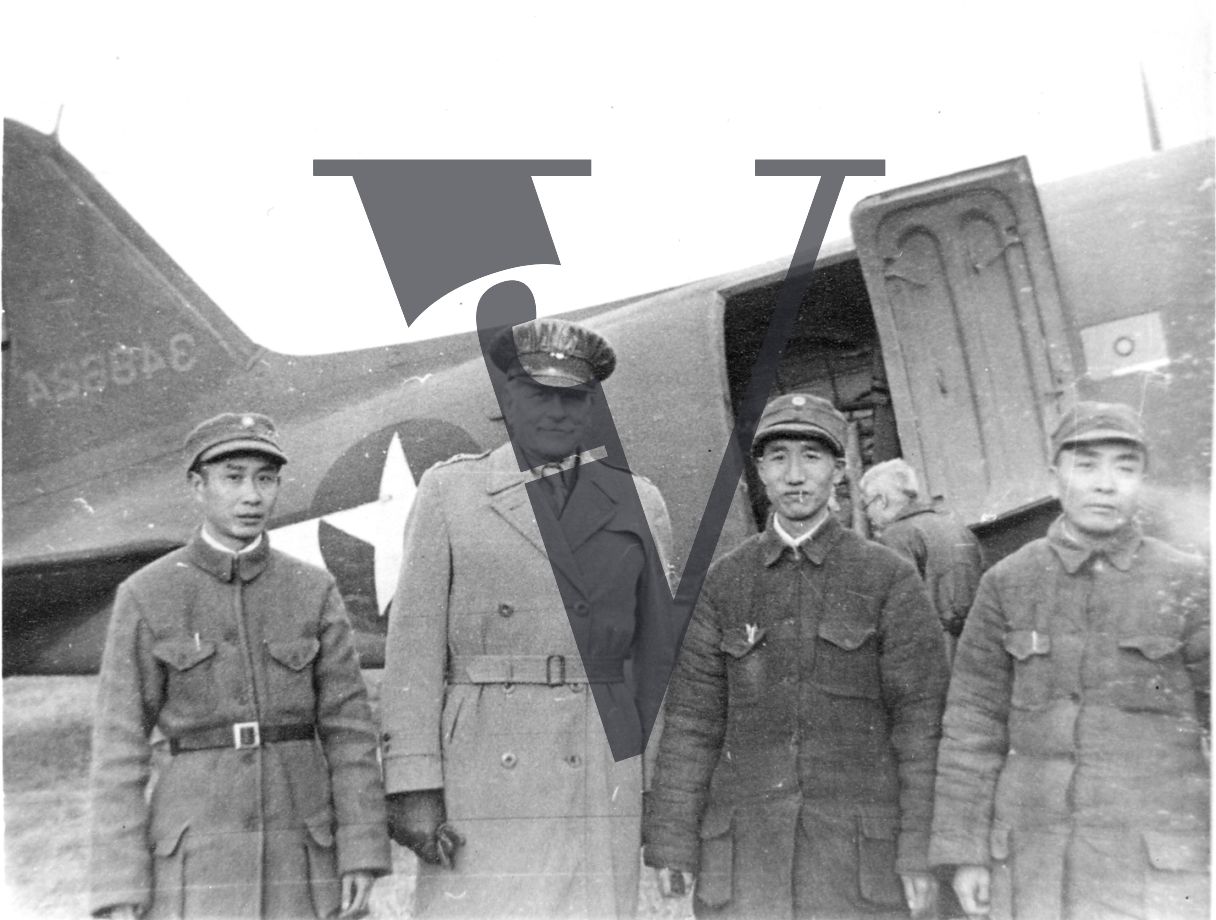 China, Yenan, General Patrick J. Hurley, Chinese officials, smiling, plane, portrait, mid-shot.