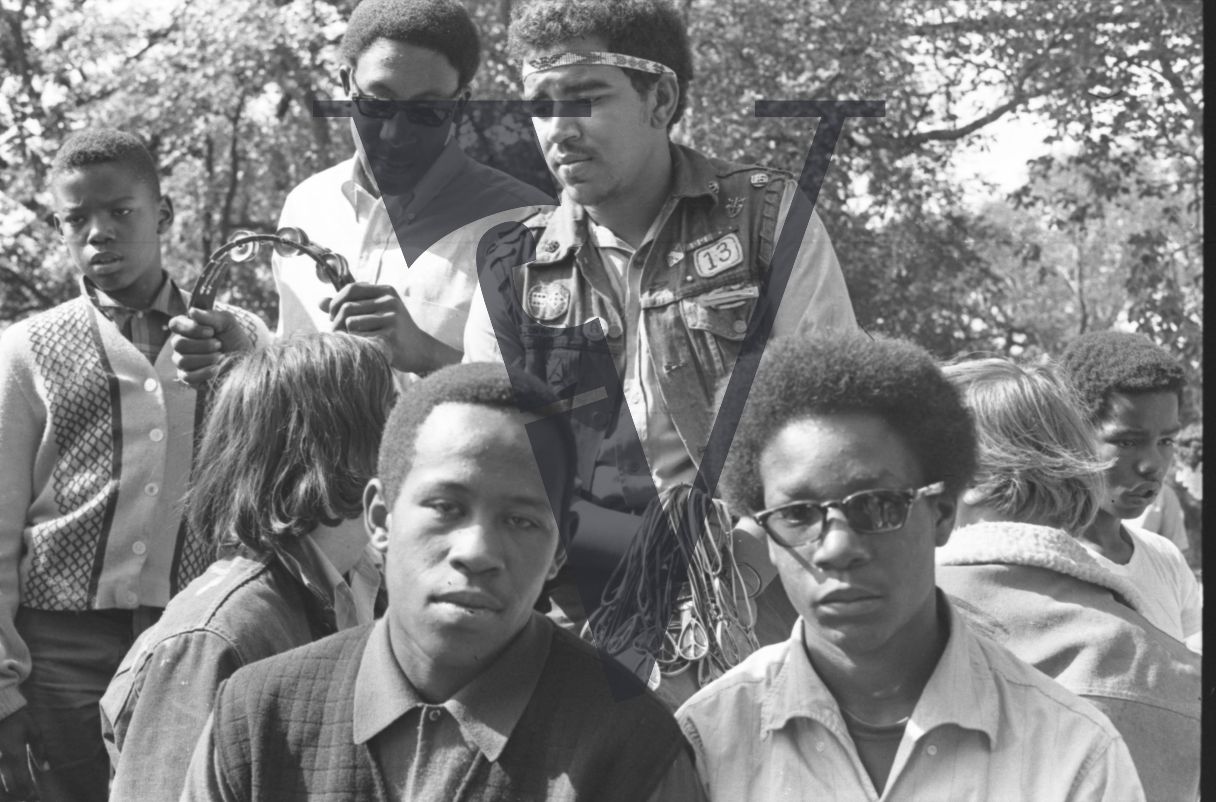 Chicago, Anti-war rallies in Lincoln Park, black youths look at camera.