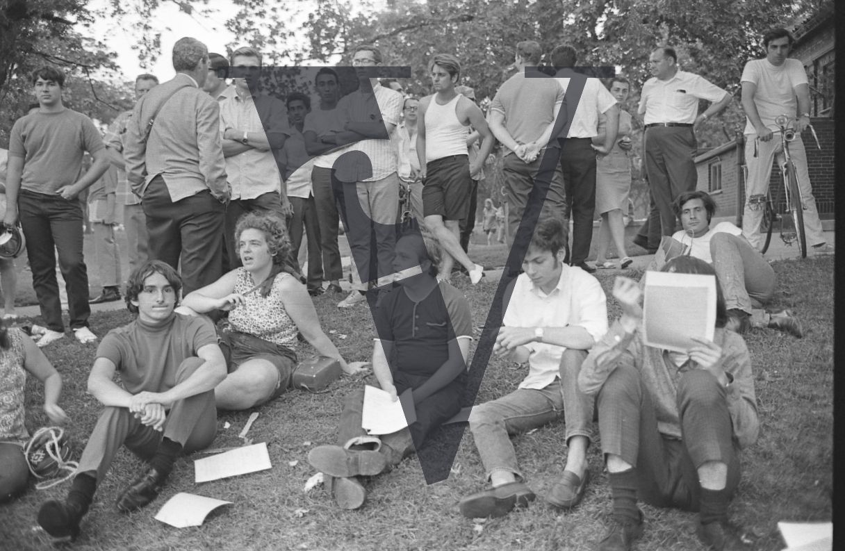 Chicago, Anti-war rallies in Lincoln Park, group of hippy youth sit crossed-leg.