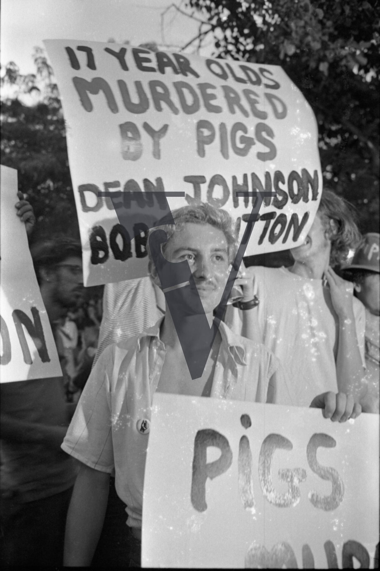 Chicago, Anti-war rallies in Lincoln Park, placards read 12 Year Olds Murderd by Pigs, Dean Johnson and Bob Hutton.