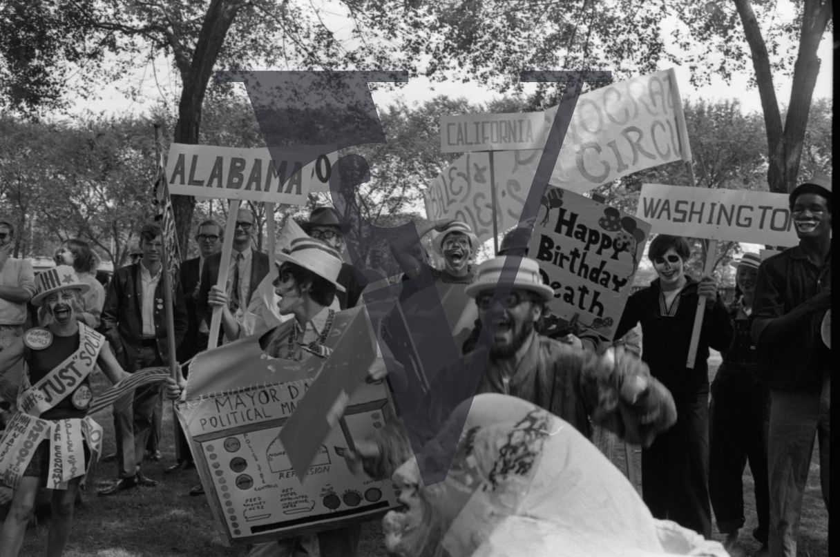 Chicago, Anti-war rallies in Lincoln Park, protesters in costumes and facepaint with placards about Mayor Daley.