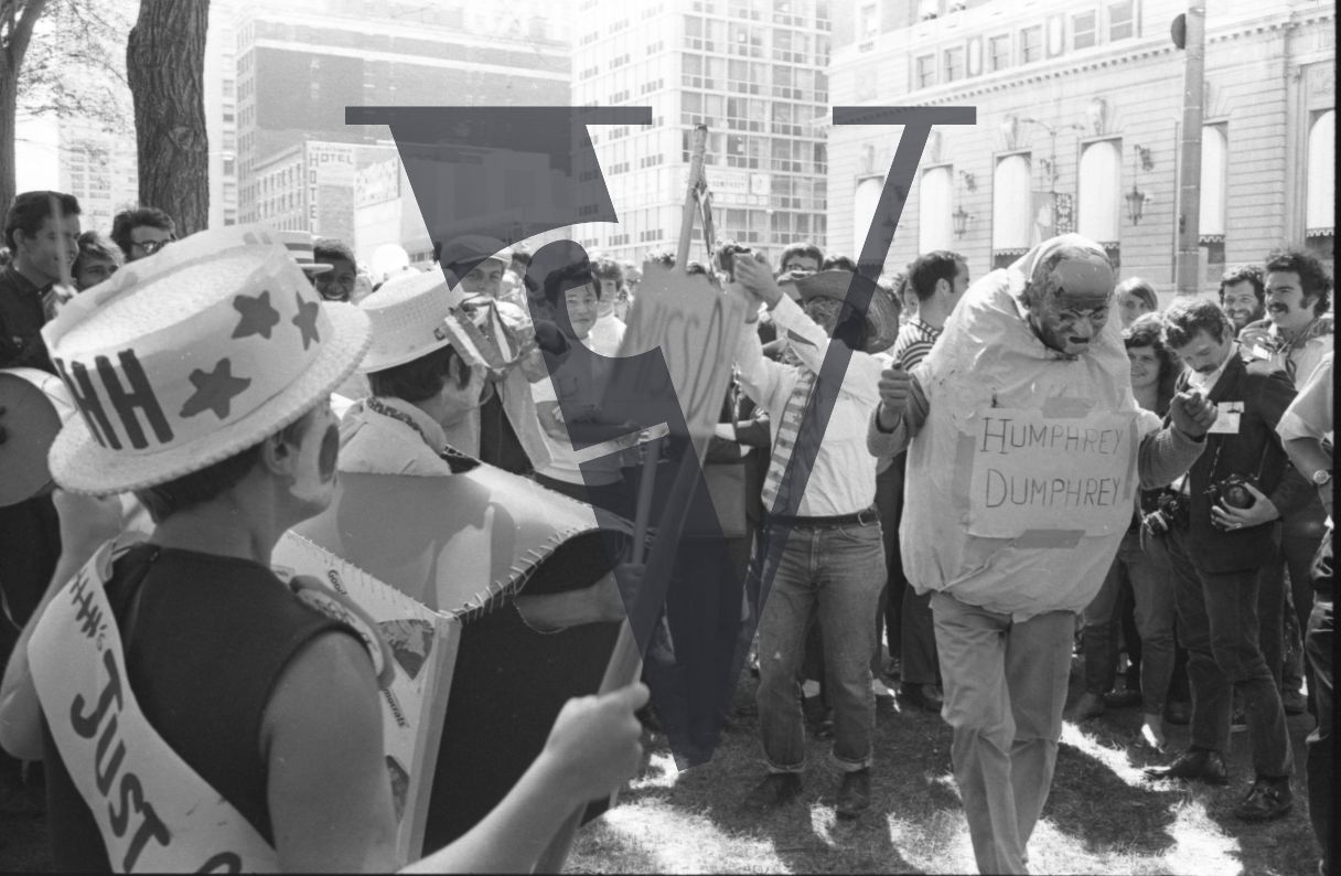 Chicago, Anti-war rallies in Lincoln Park, protesters in costumes and facepaint with one in 'Humprey Dumphrey' outfit.