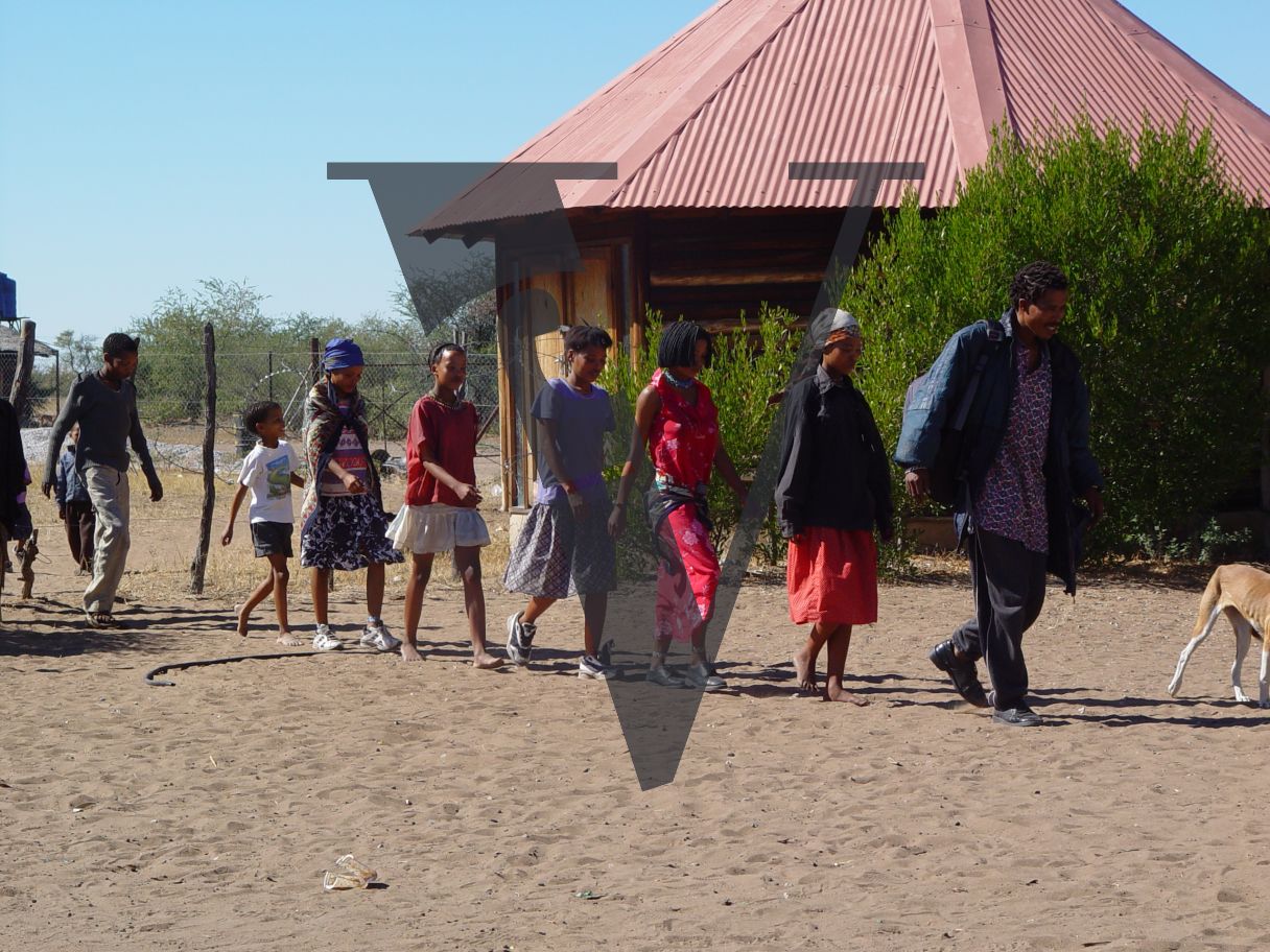 N!Xau, the “Bushman”, group walking, journey.