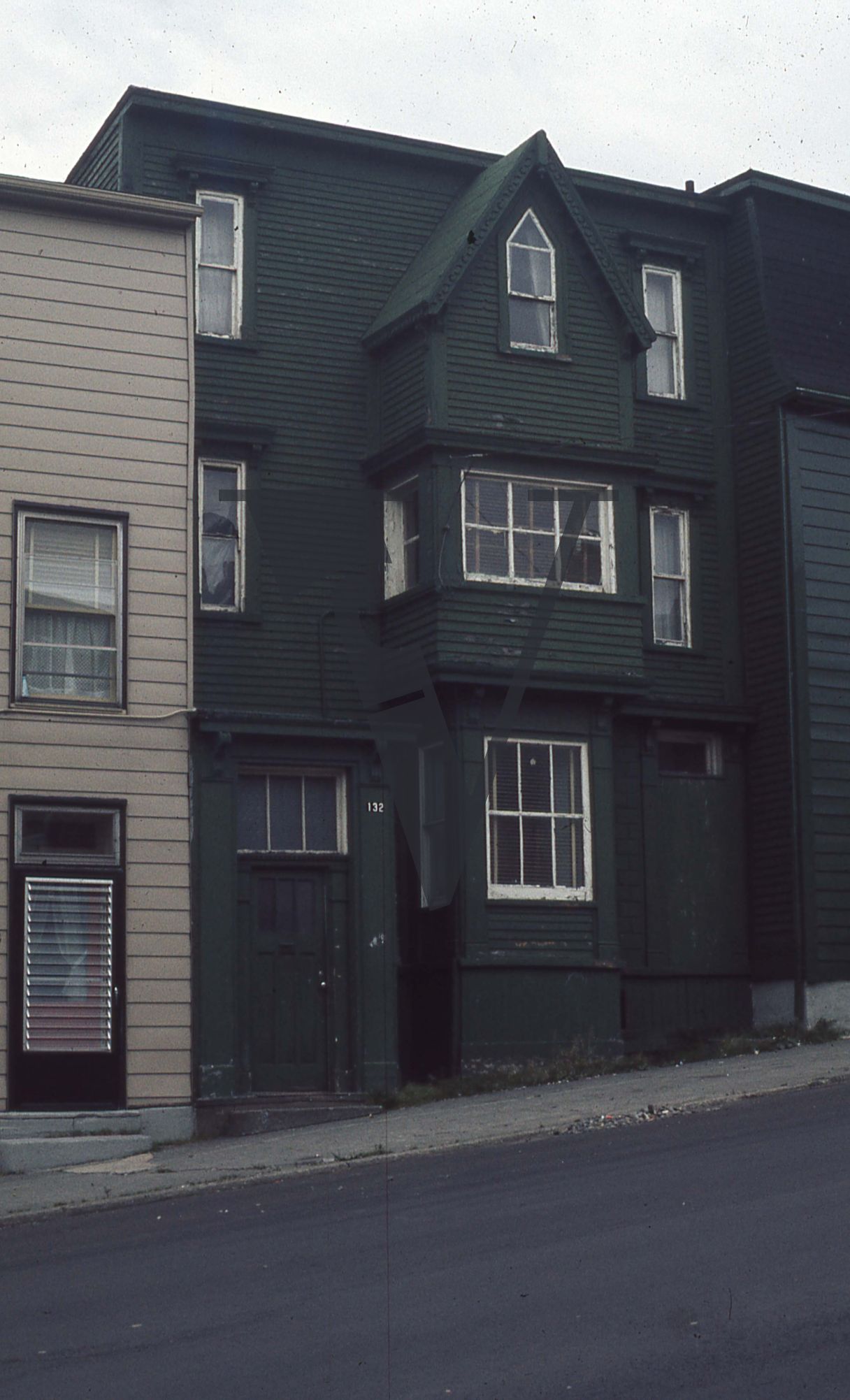 Newfoundland, St. Johns, capital city, black fronted, wooden house.