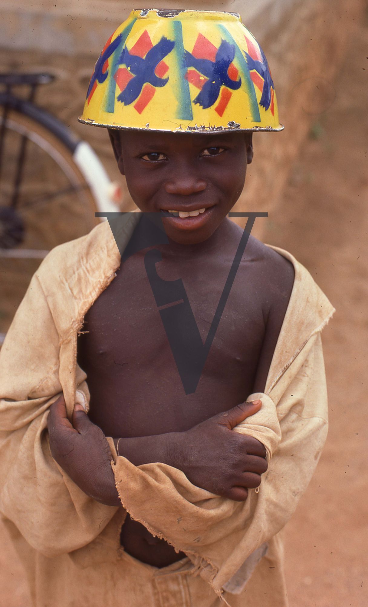 Nigeria, boy with painted pot, portrait.