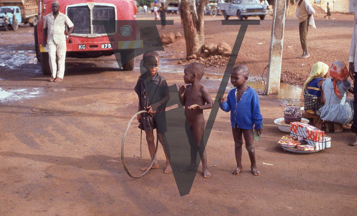Nigeria, three boys on street.