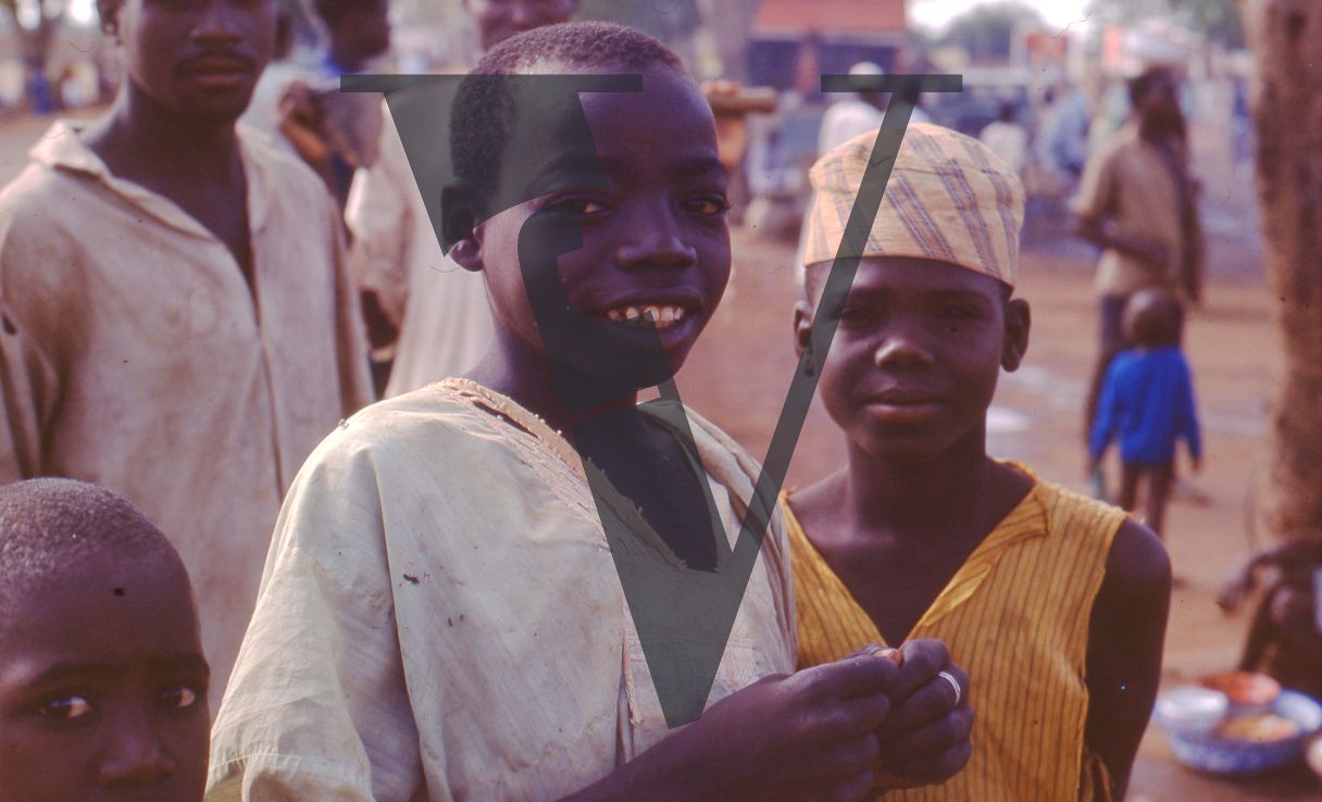 Nigeria, two boys smiling, portrait.