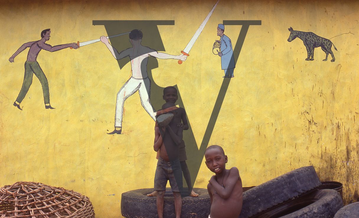 Nigeria, boys in front of folk art murals.