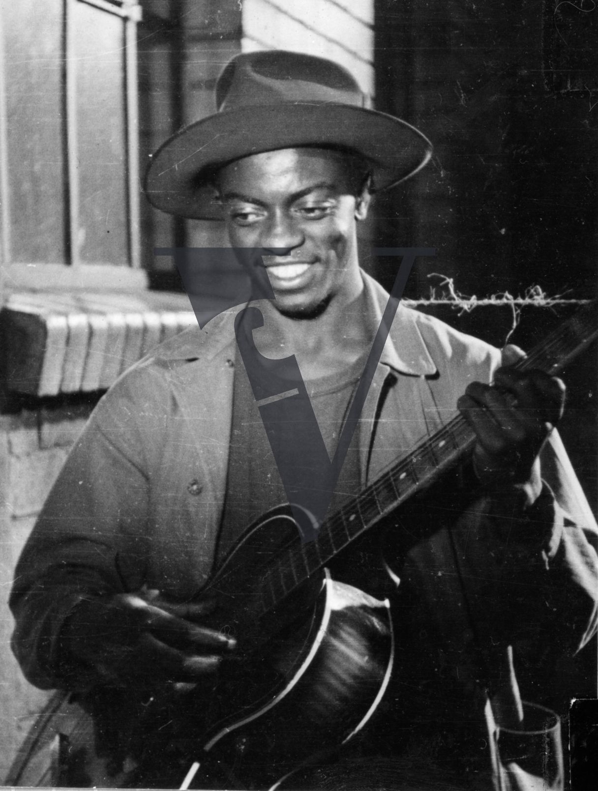 African Jim, General Duze playing guitar.