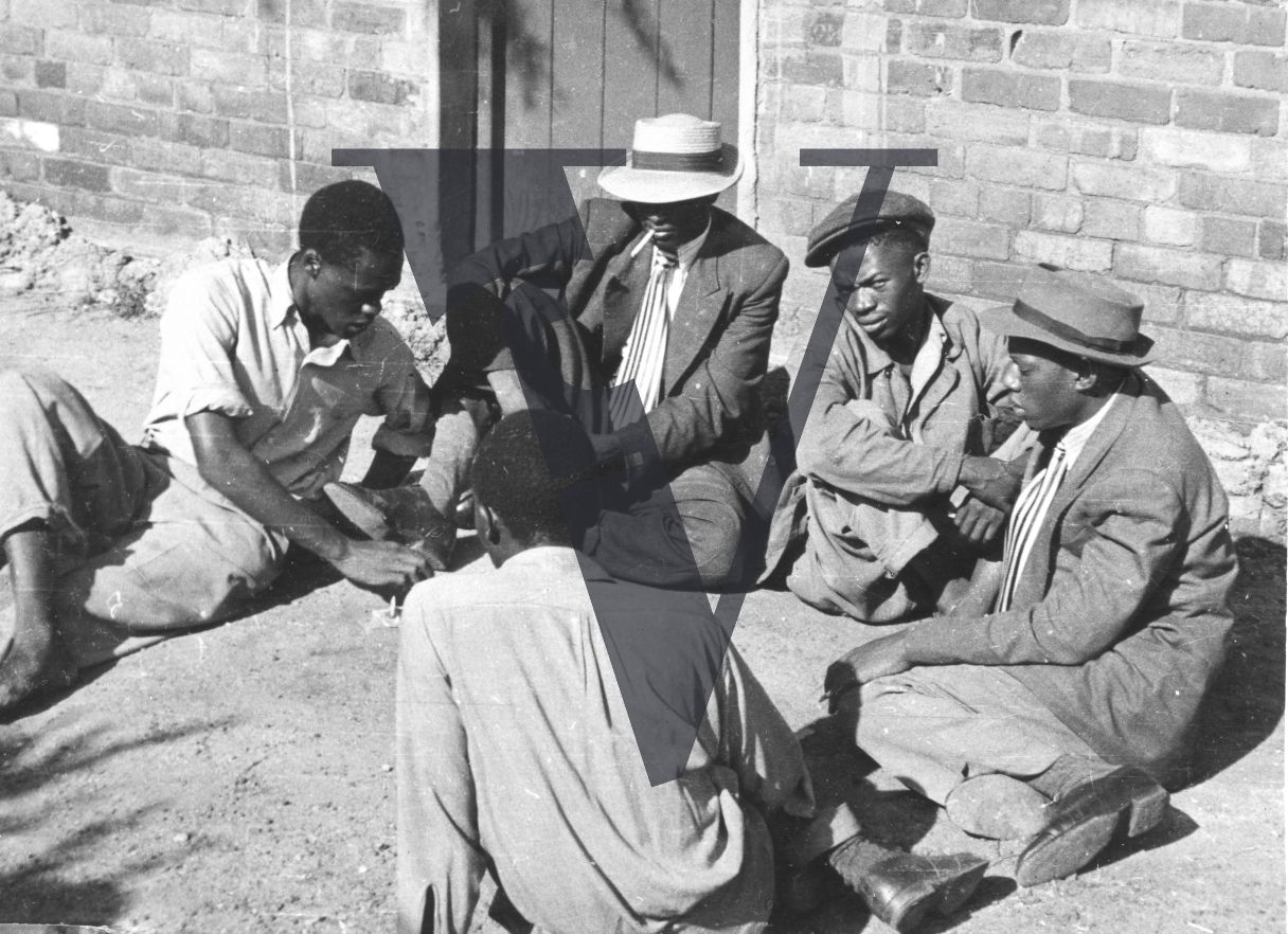 African Jim, Tsotsis gambling on street corner.