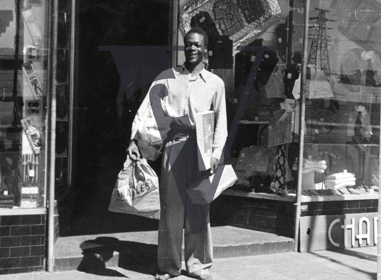 African Jim, Daniel Adnewmah as Jim Twala shopping.