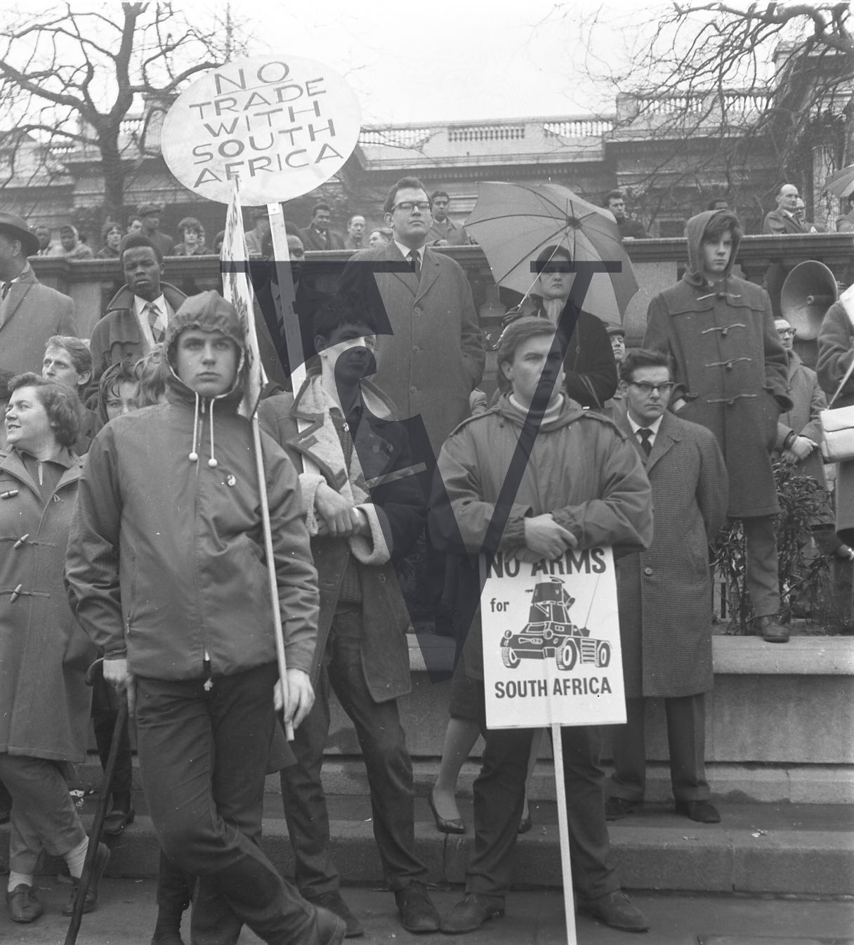 Anti-Apartheid Demo, Trafalgar Square, group with placards.