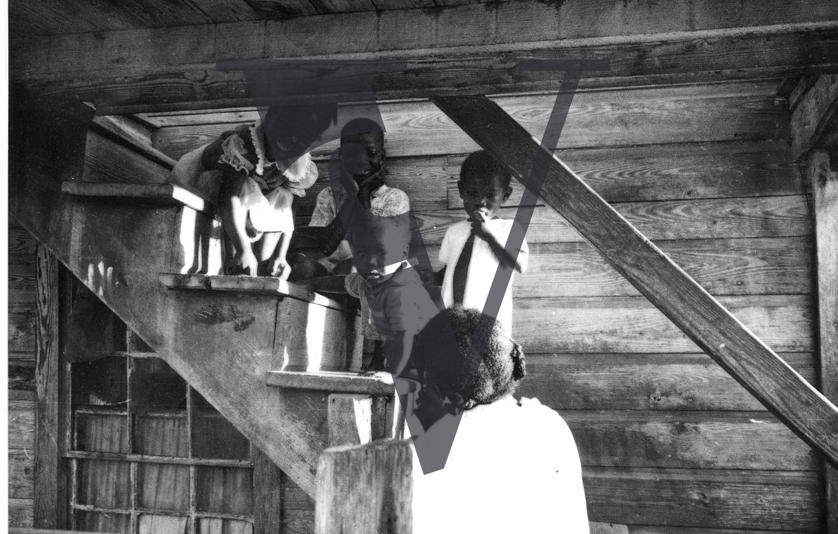 Belize, kids on staircase, portrait.