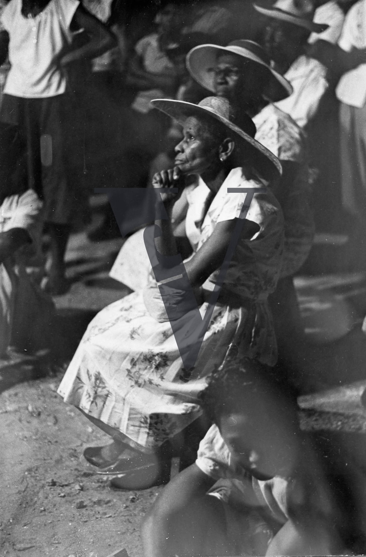 Belize, George Cadle Price, election meeting, crowd, woman looks on.