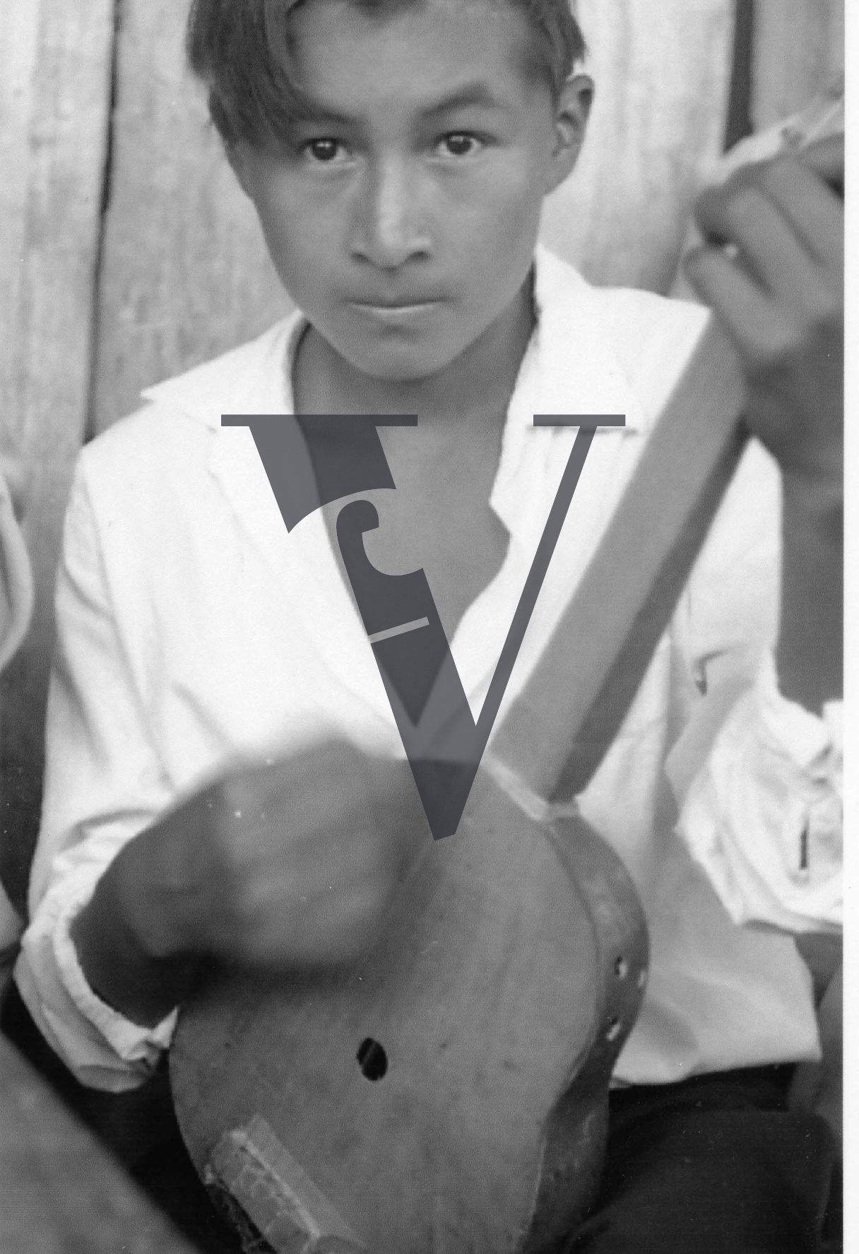 Belize, Kekchi, musician, boy, playing stringed instrument, close-up, portrait.