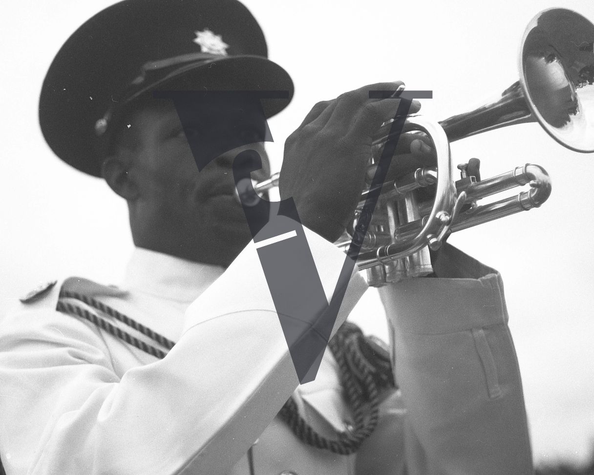 Belize, parade, soldier in uniform, military band, trumpet player.