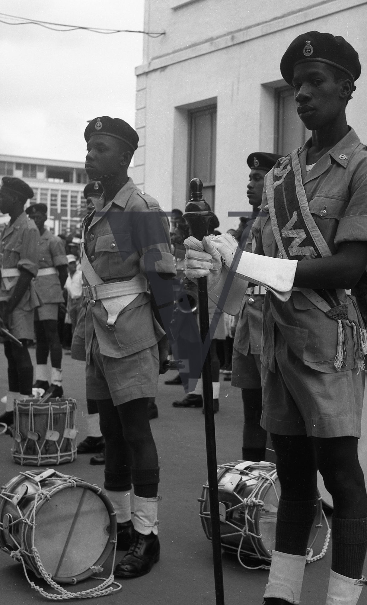 Belize, Military parade, young men in unifrom, drums on floor.