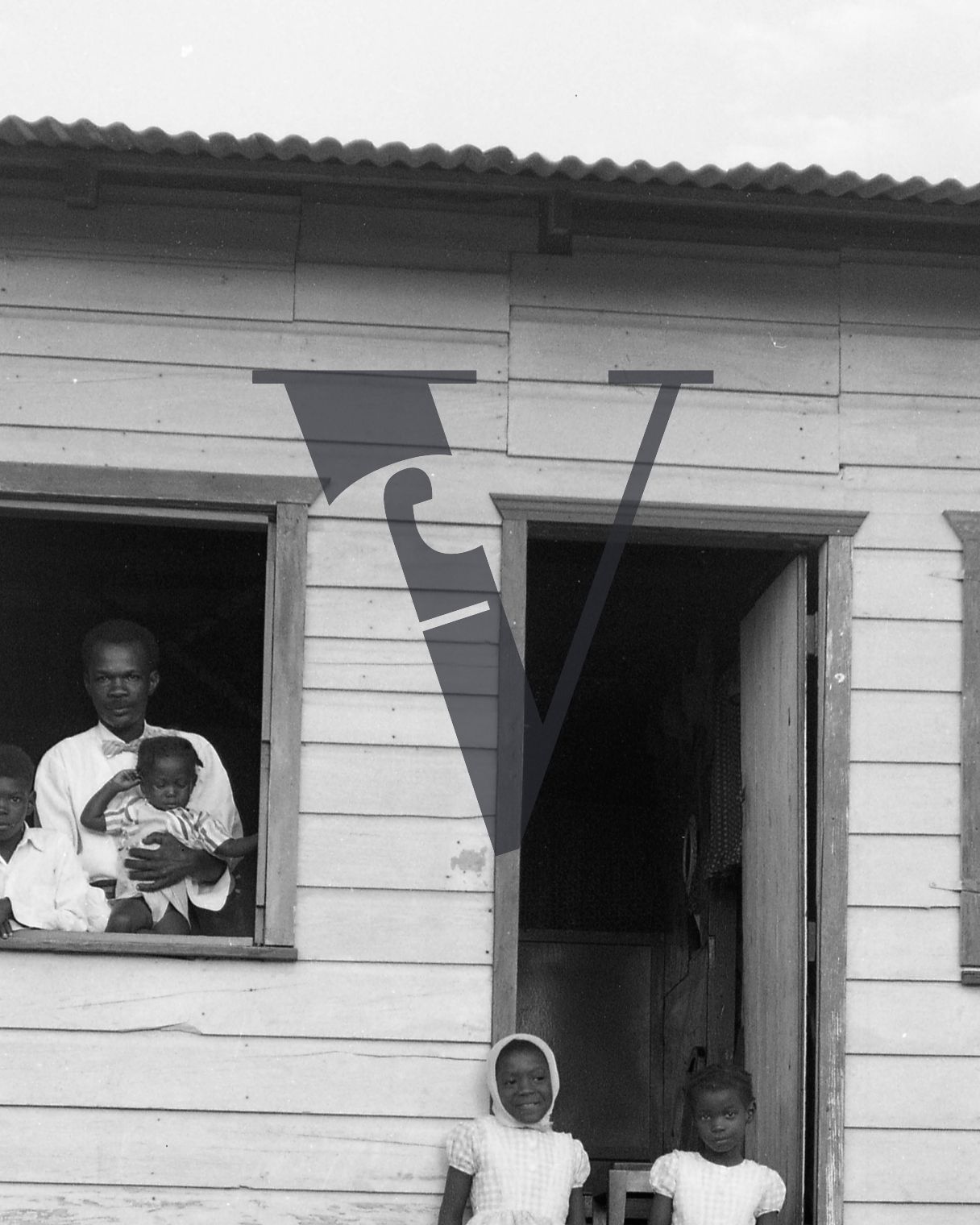 Belize, housing, family portrait, cropped.