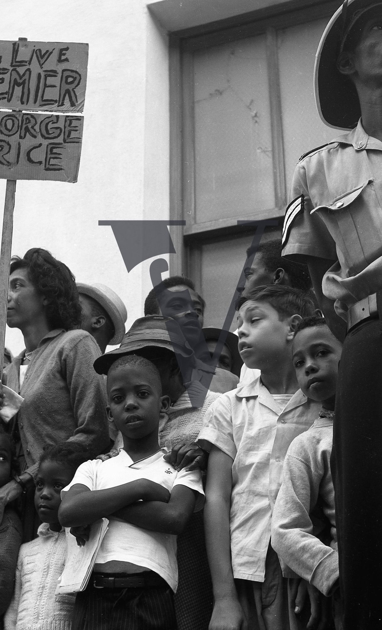 Belize, Political Demonstration, children stand by a policeman.