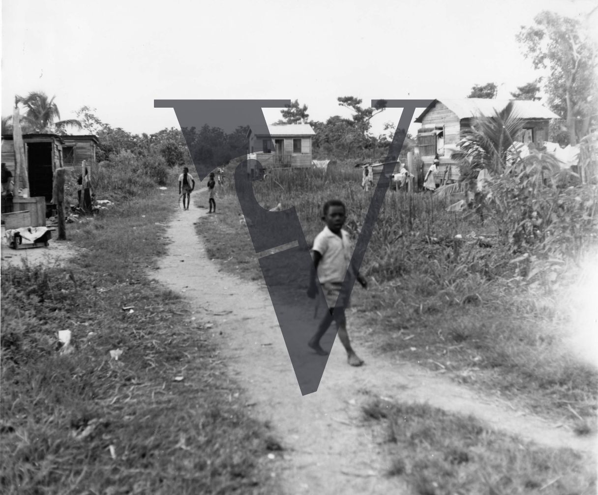 Belize, rural village, boy in shot.