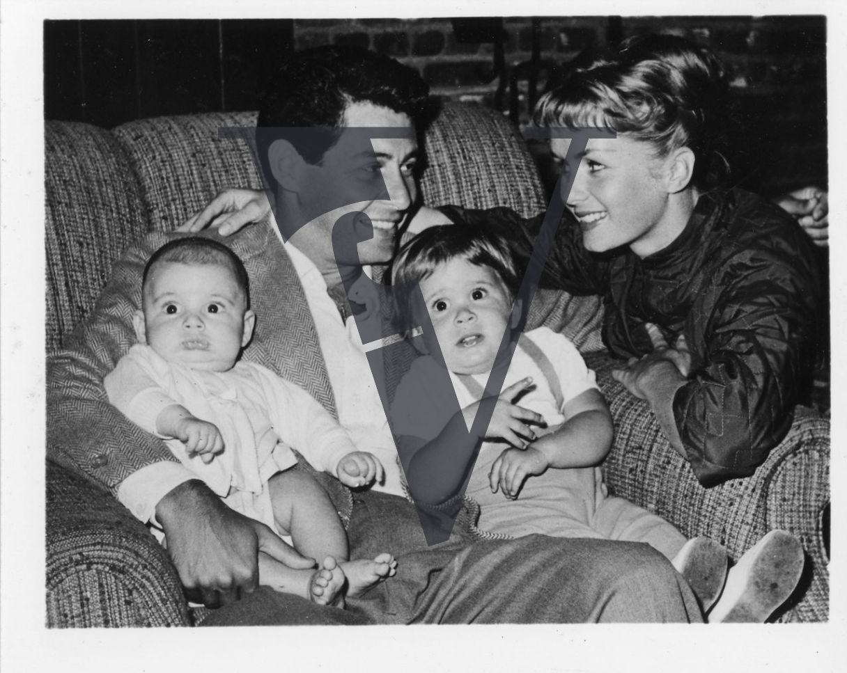 Eddie Fisher and Debbie Reynolds with children Carrie Fisher and Todd Fisher, seated, portrait.