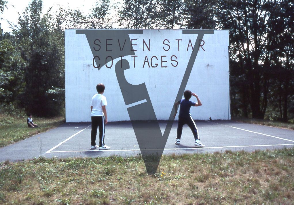 Seven Star Cottages handball court, three boys playing, nike trainers.