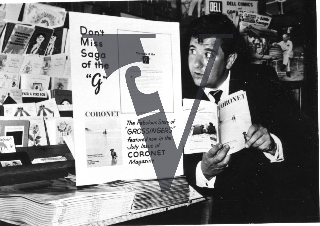 Buddy Hackett, actor, comedian, Grossinger's Catskill Resort Hotel, newsstand, portrait, mid-shot.