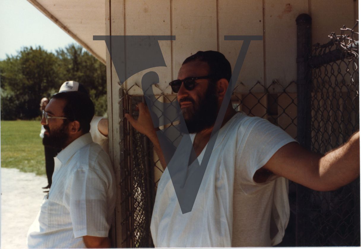 Orthodox Jews playing baseball, Hasidic, mid-shot.