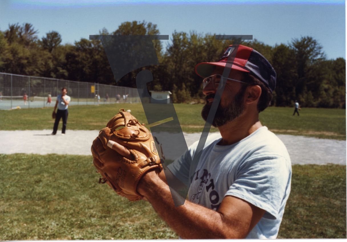 Orthodox Jews playing baseball, Hasidic, pitcher, glove, mid-shot.