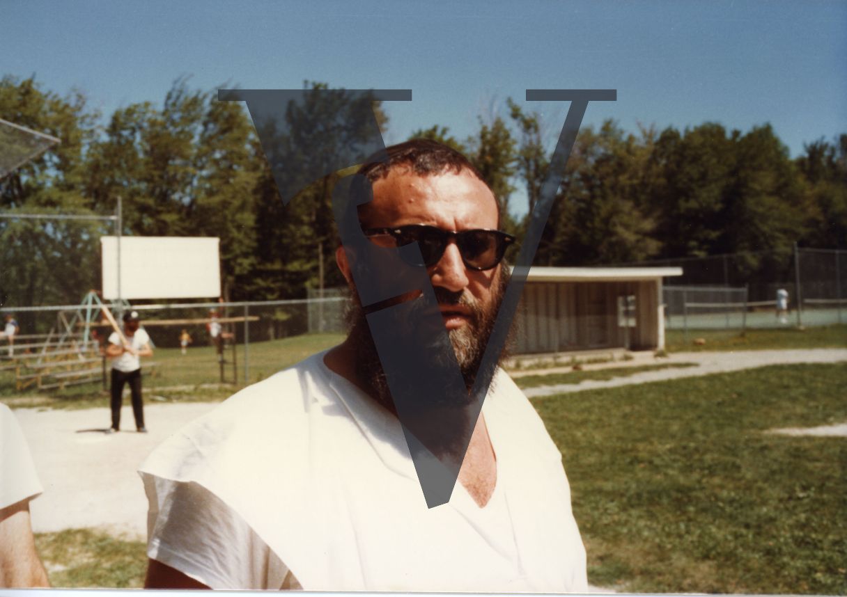Orthodox Jews playing baseball, Hasidic, sunglasses, portrait, medium close-up.