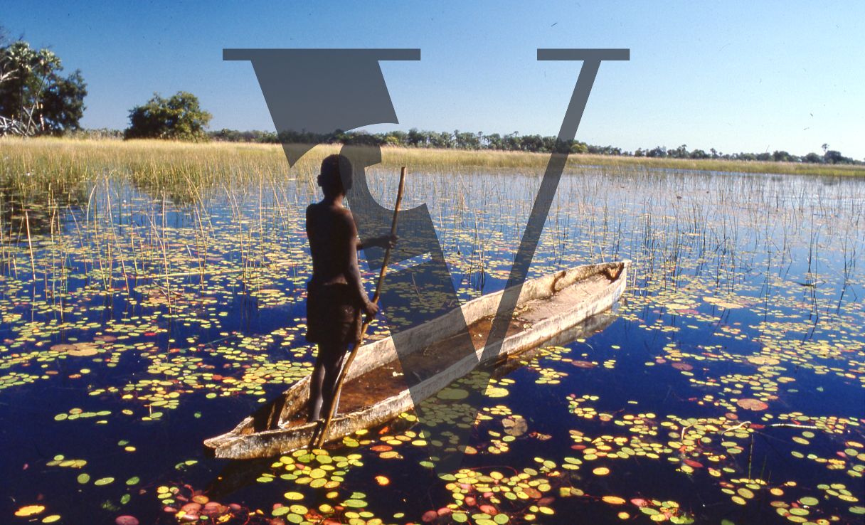 Botswana, Okvango, Boy In Boat.