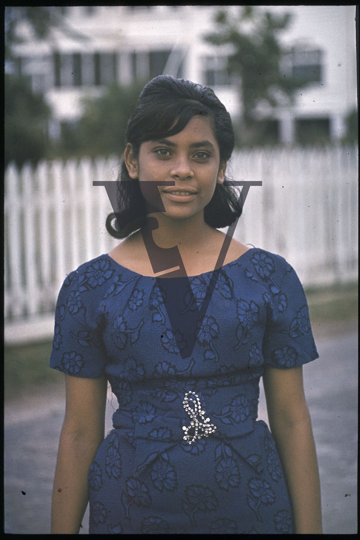 Belize, Woman stands in portrait.