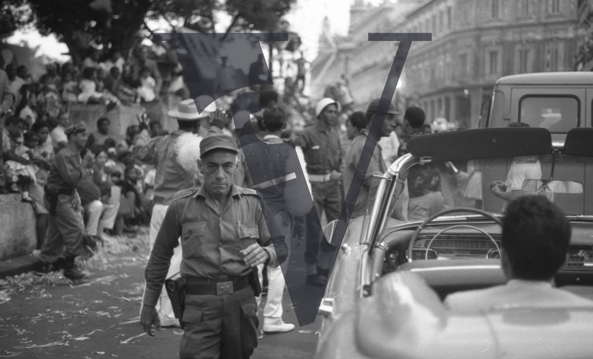 Cuba, Havana Carnival, policeman looks at the camera.