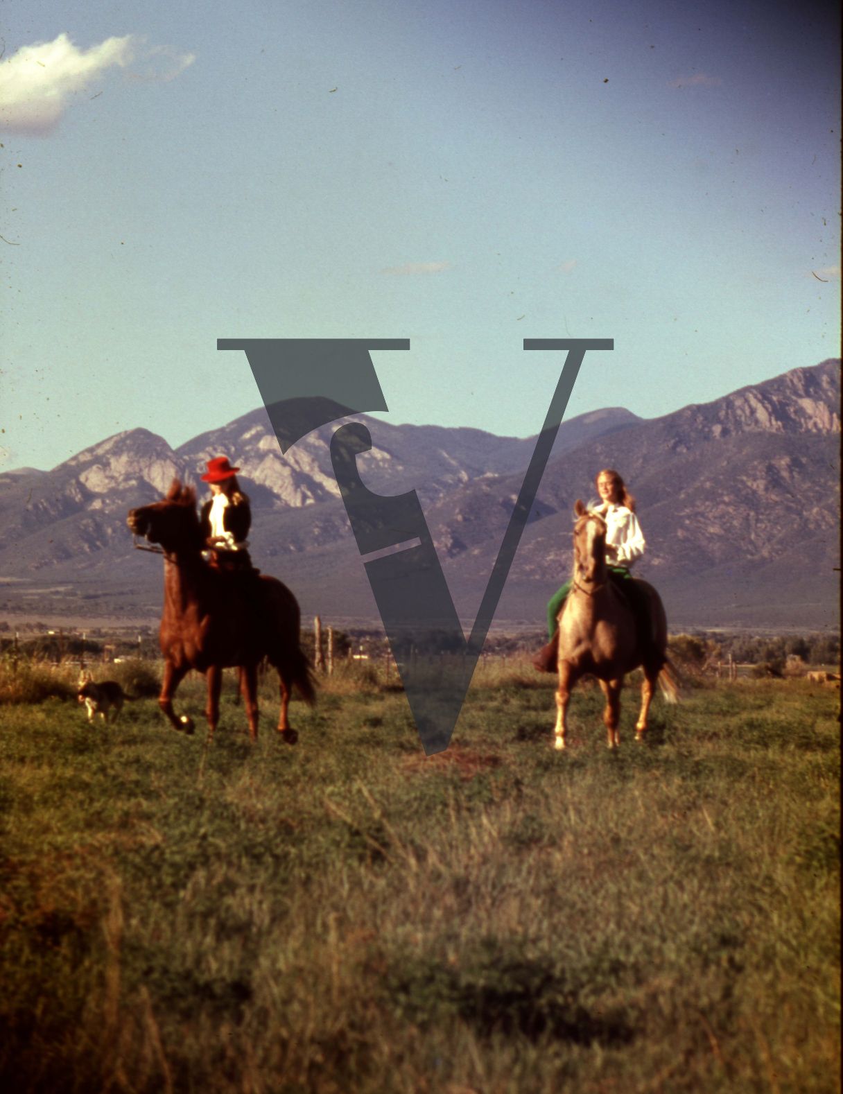 Taos, New Mexico,woman on horseback, mountains.