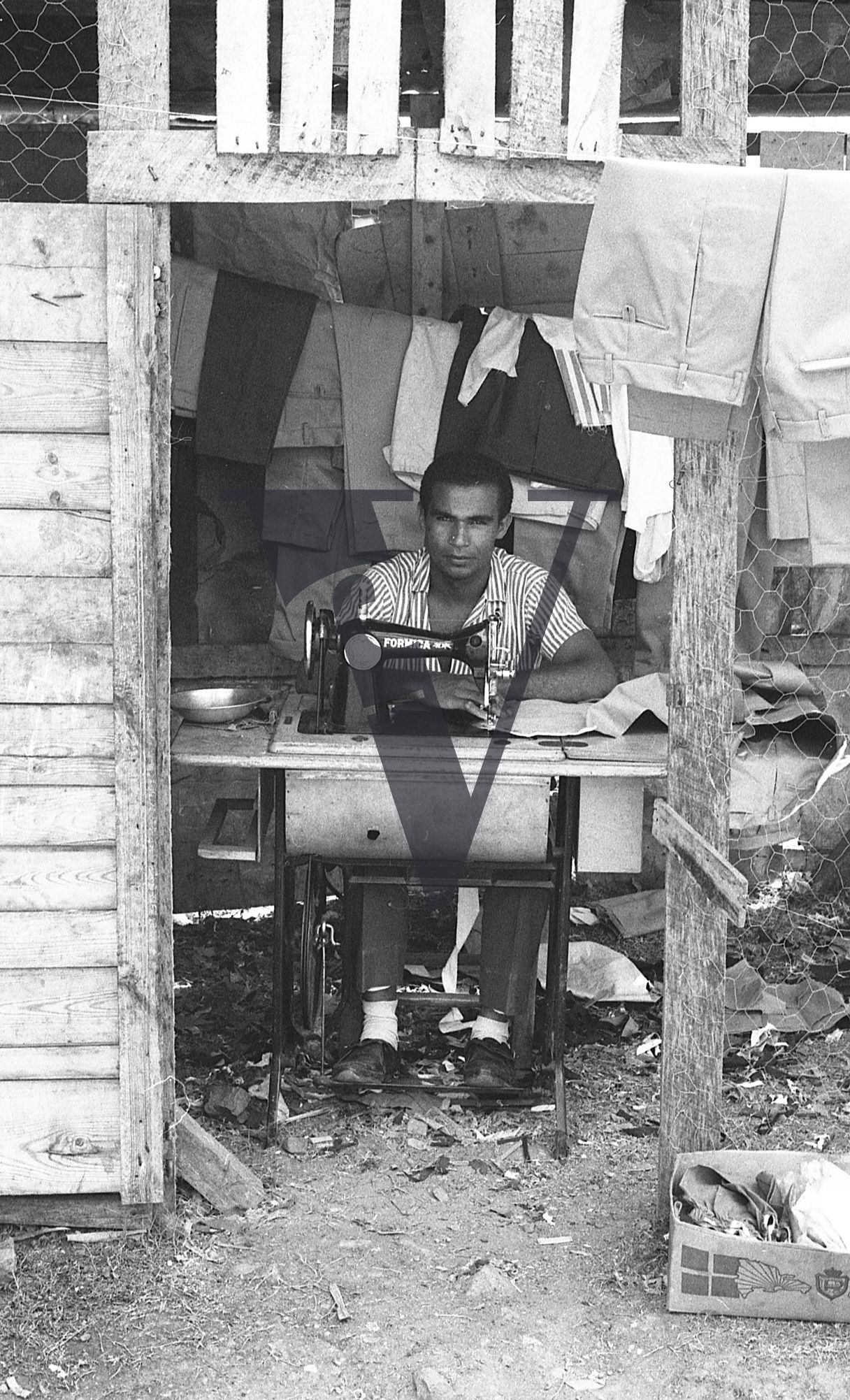 Dominican Republic, tailor, portrait, Formica sewing machine.