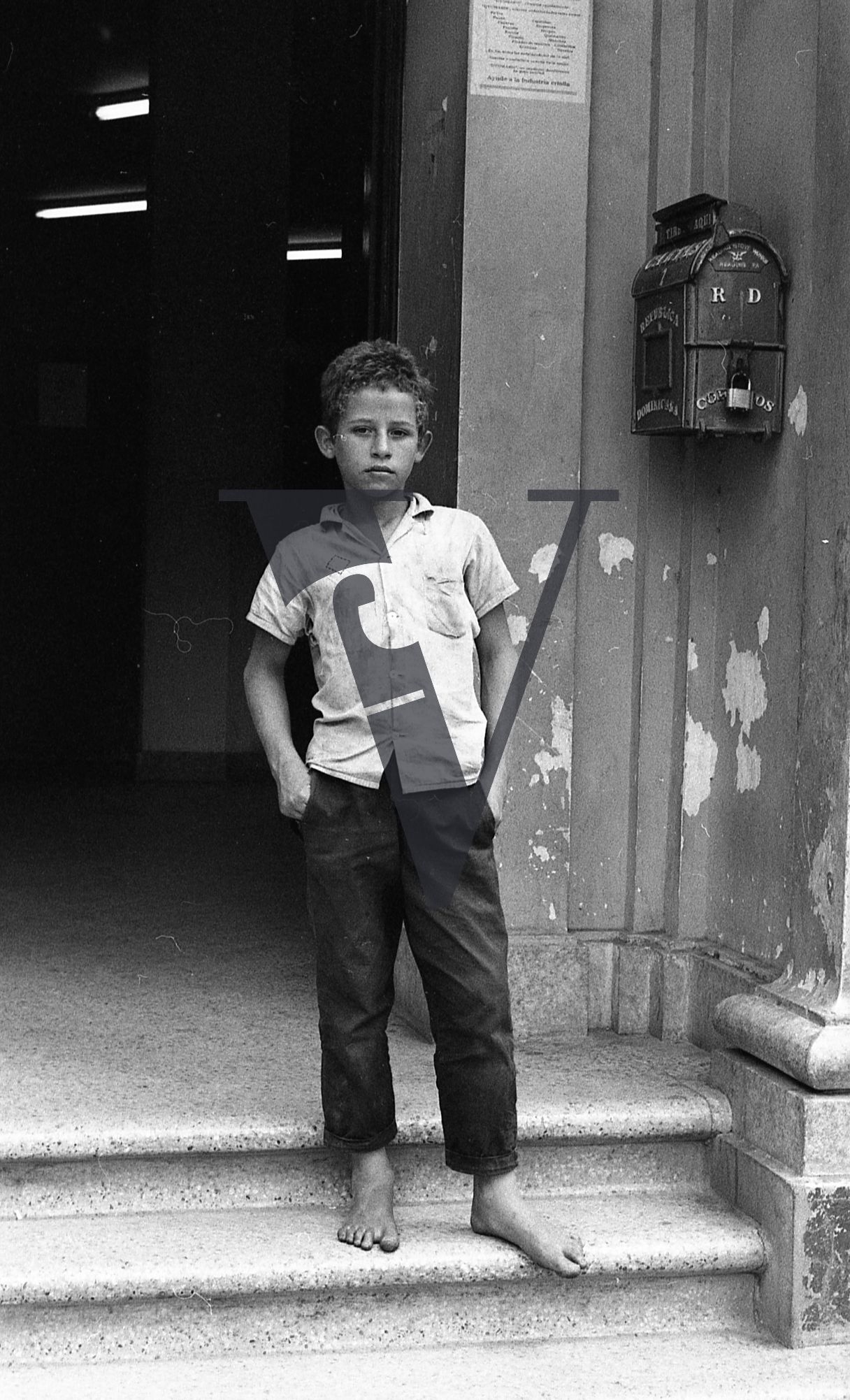 Dominican Republic, boy, portrait, doorway.