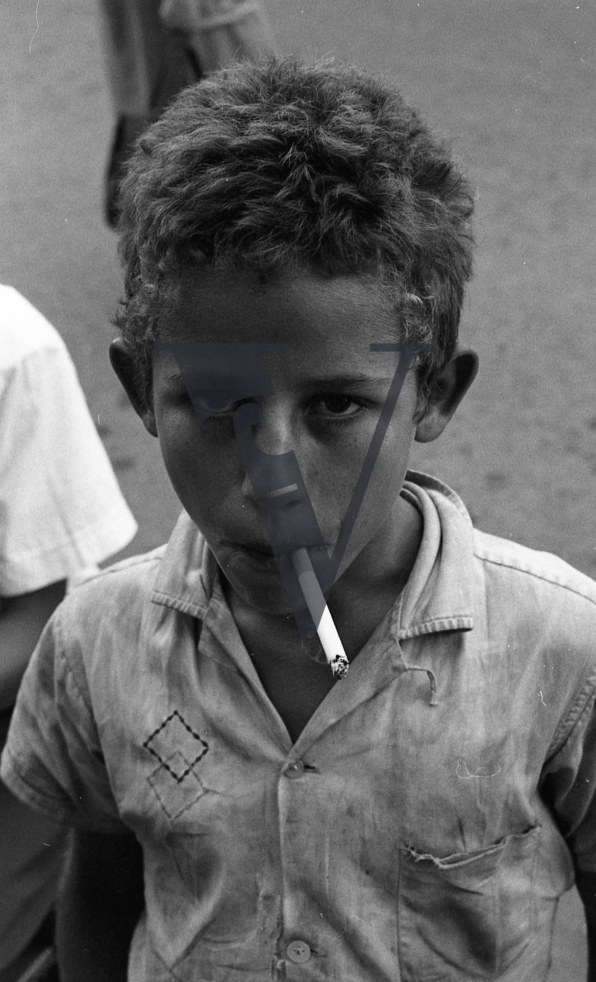 Dominican Republic, boy, portrait, blowing smoke.