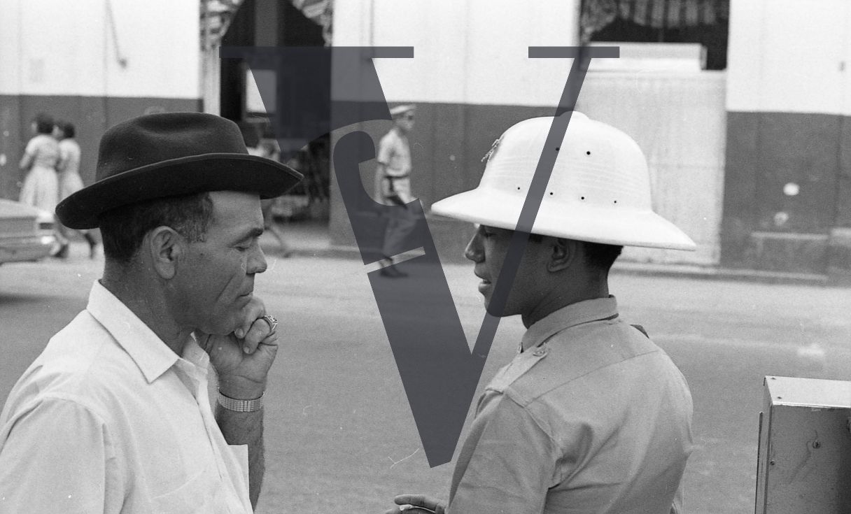 Dominican Republic, man and police in discussion.