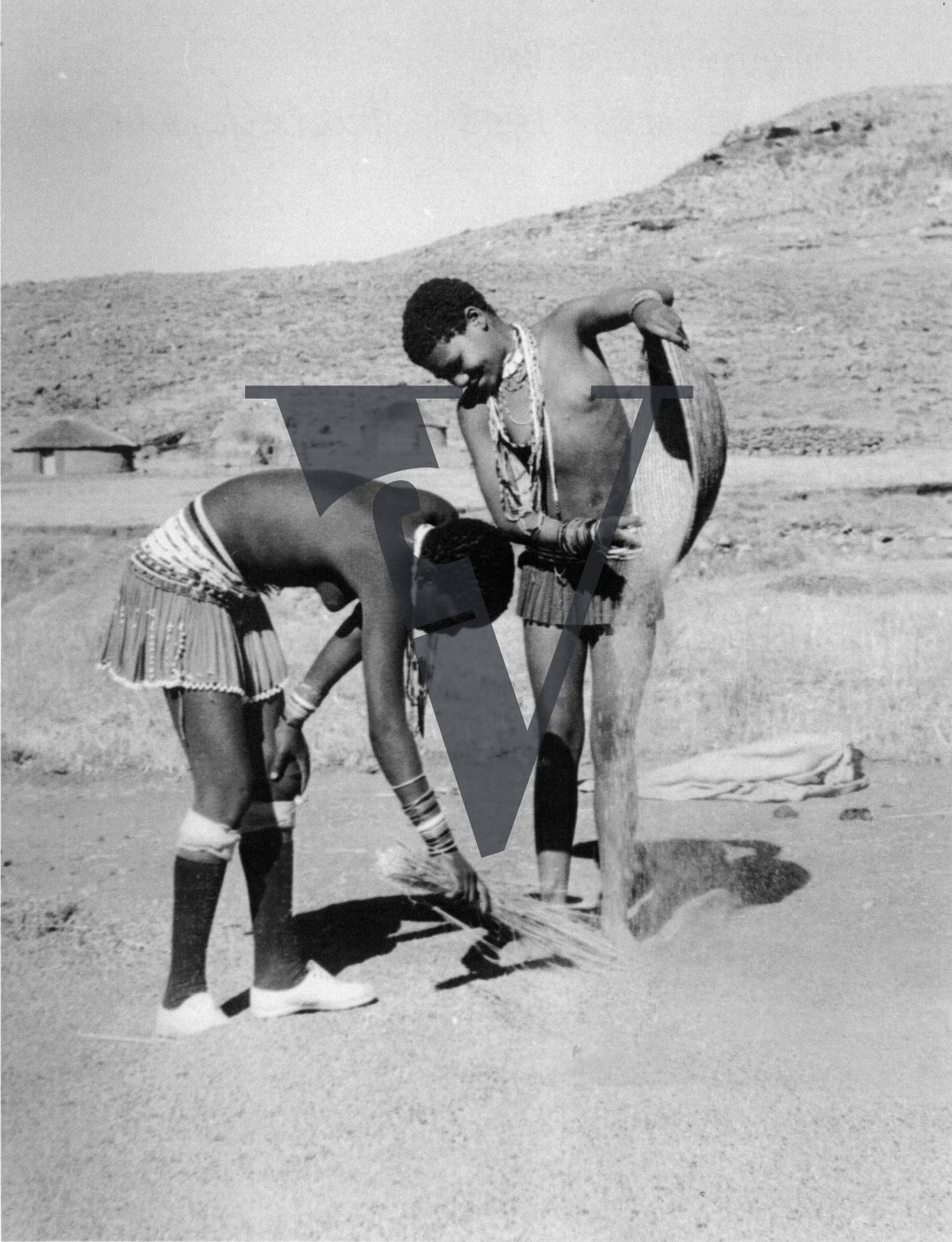Zululand, children at work, winnowing corn.