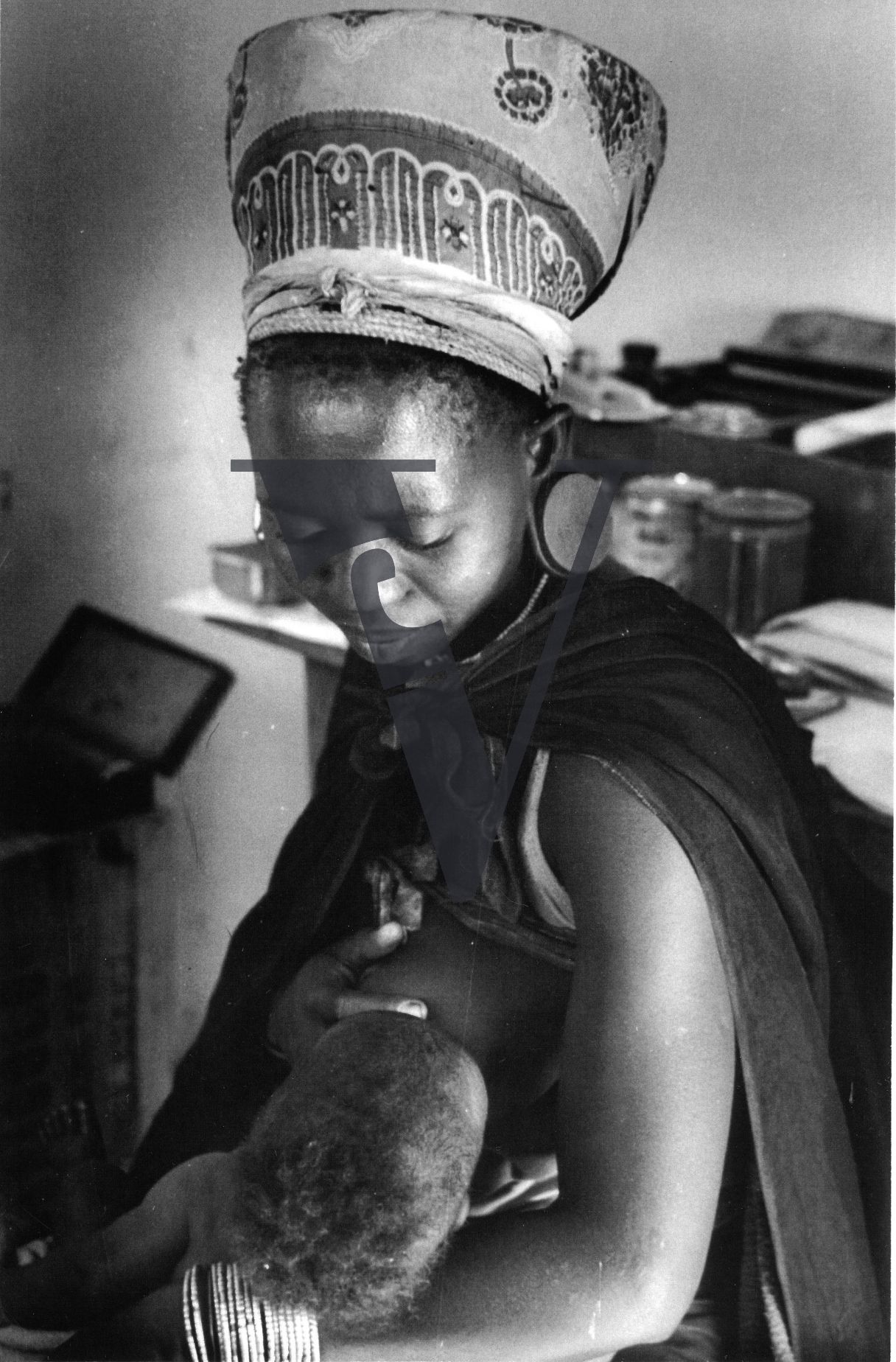Zululand Mother, breastfeeding, black and white portrait.