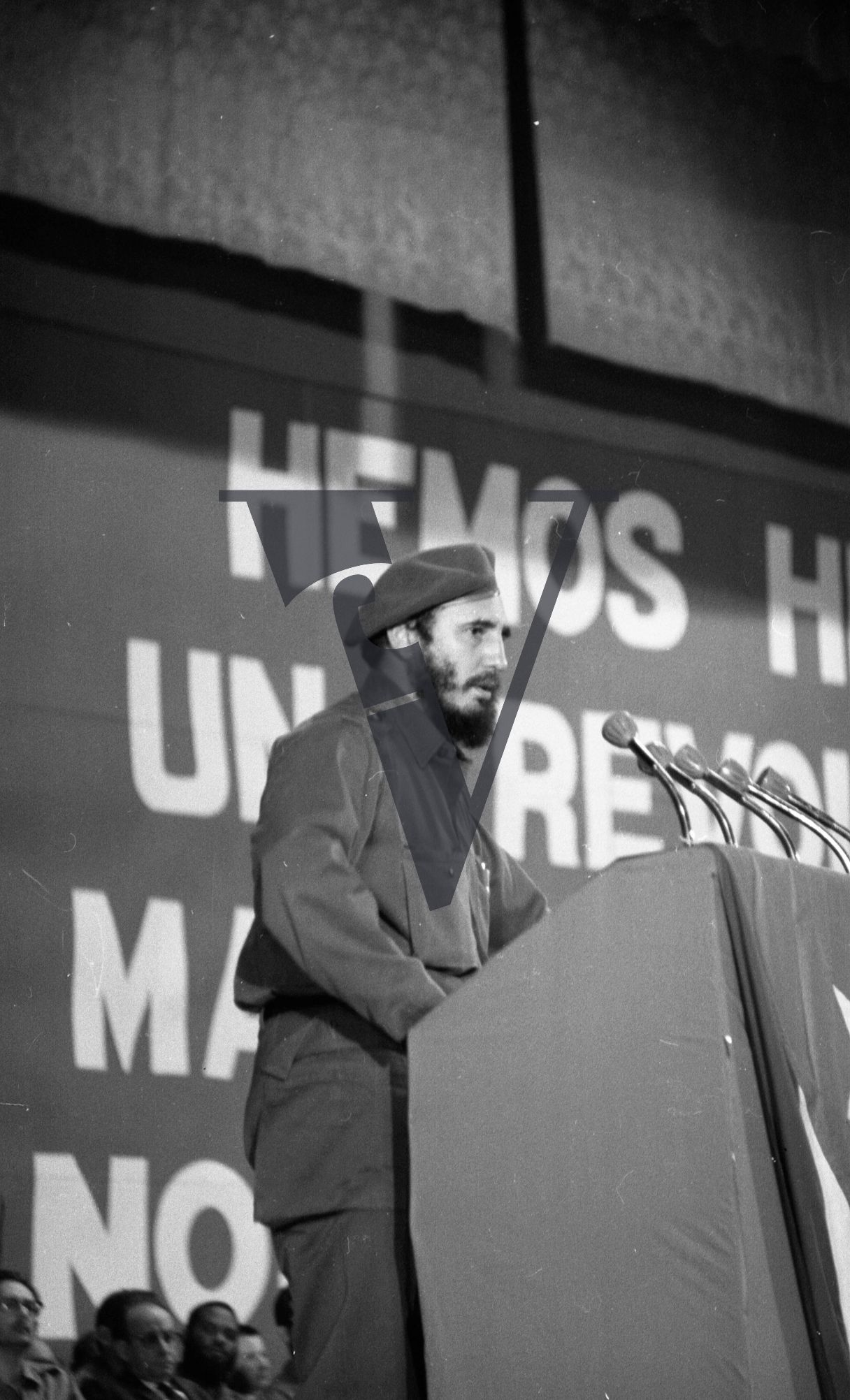 Cuba, Fidel Castro conference speech, standing at plinth.