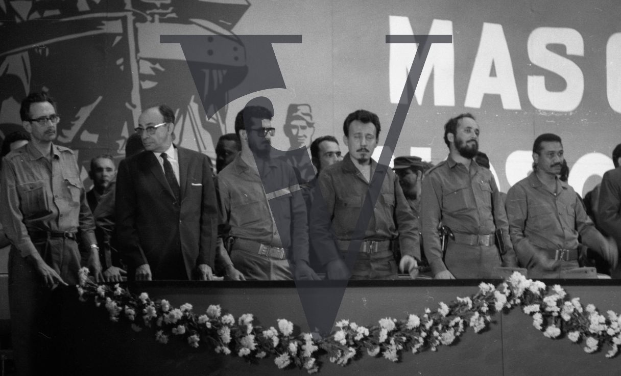 Cuba, Fidel Castro conference speech, government officials stand in line.