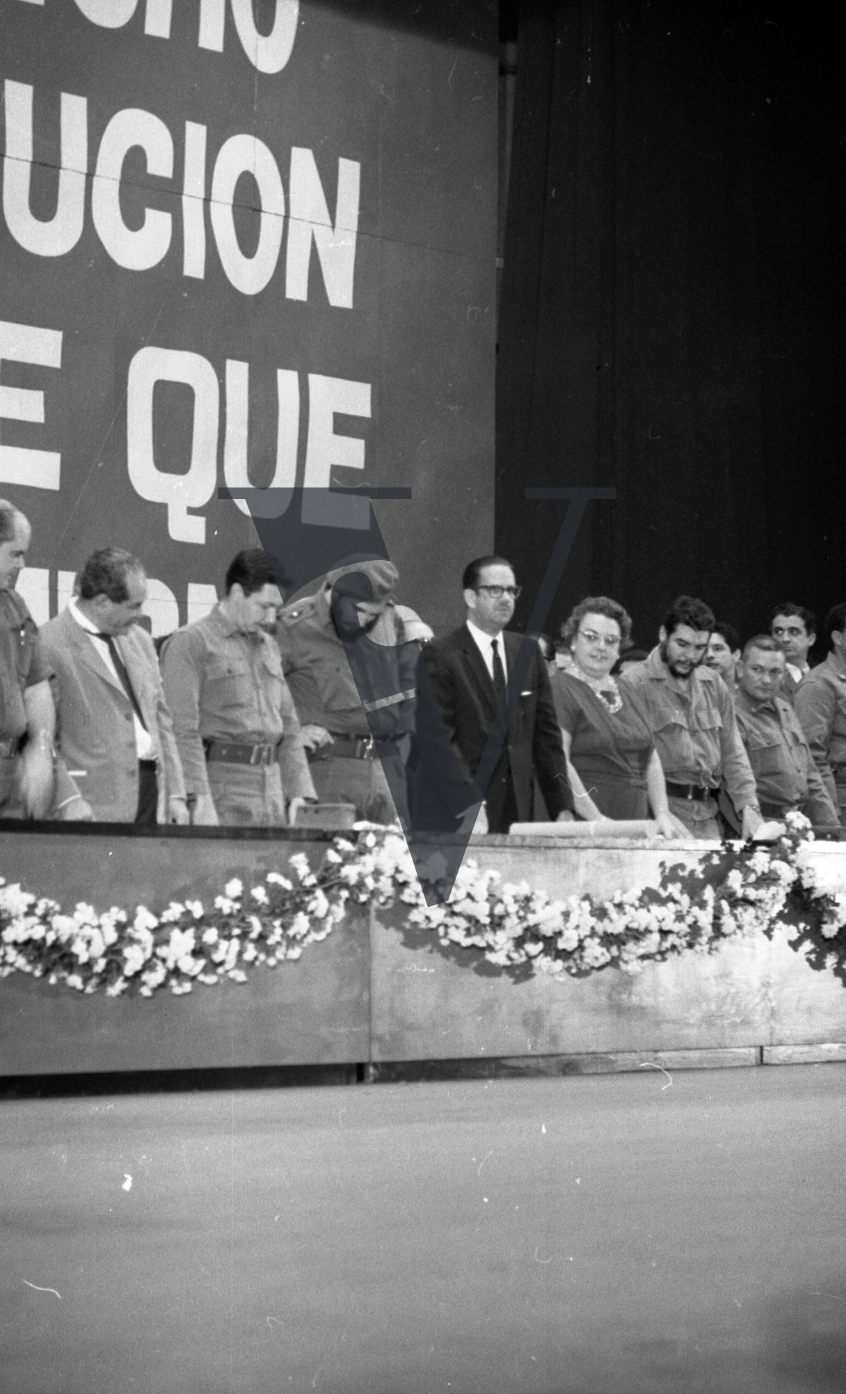 Cuba, Fidel Castro conference speech, government officials stand in line, Castro inspects.
