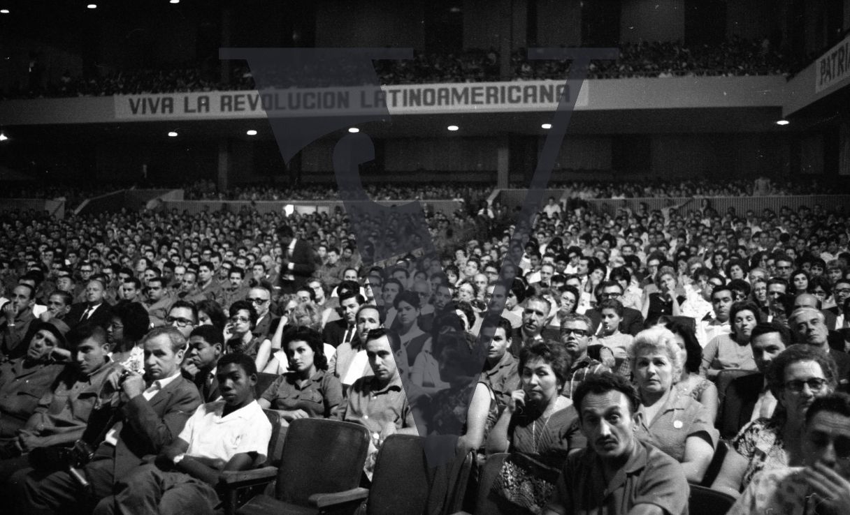 Cuba, Fidel Castro conference speech, crowd shot, Viva La Revolucion Latino Americana.